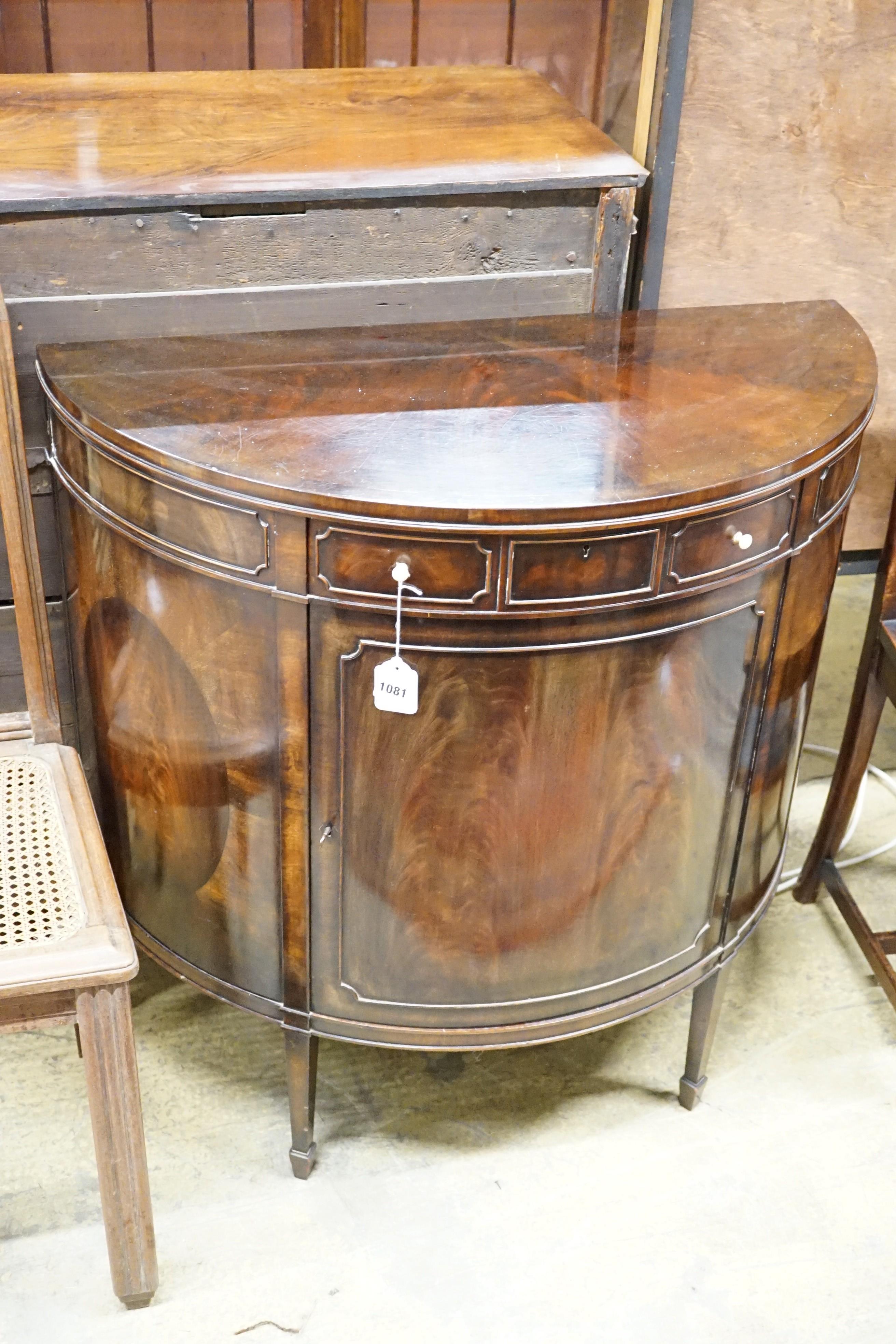 An early 20th century Maple & Co. mahogany demi-lune side cabinet with frieze drawer, width 84cm, height 84cm